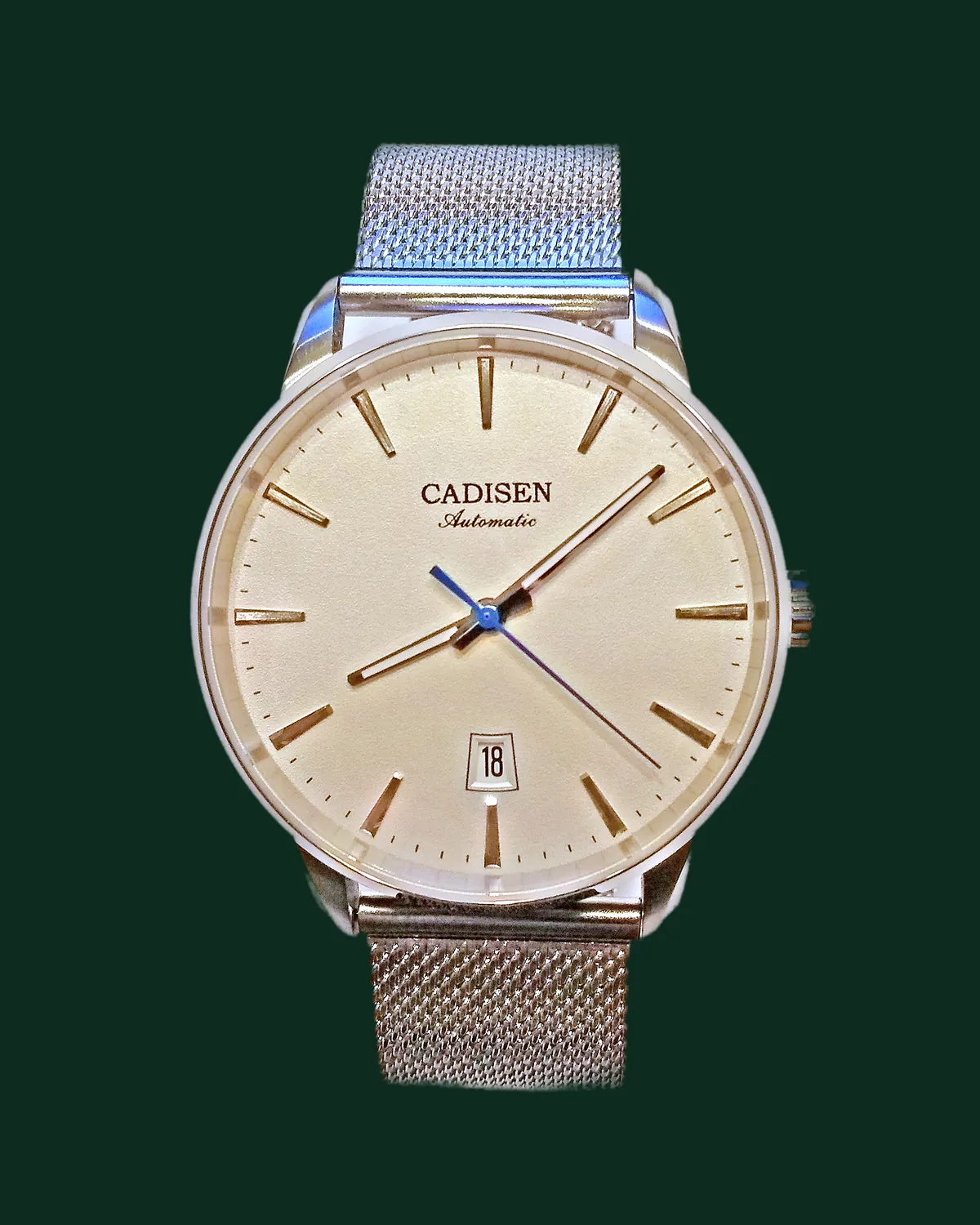 A dress watch with a cream dial and a steel bracelet