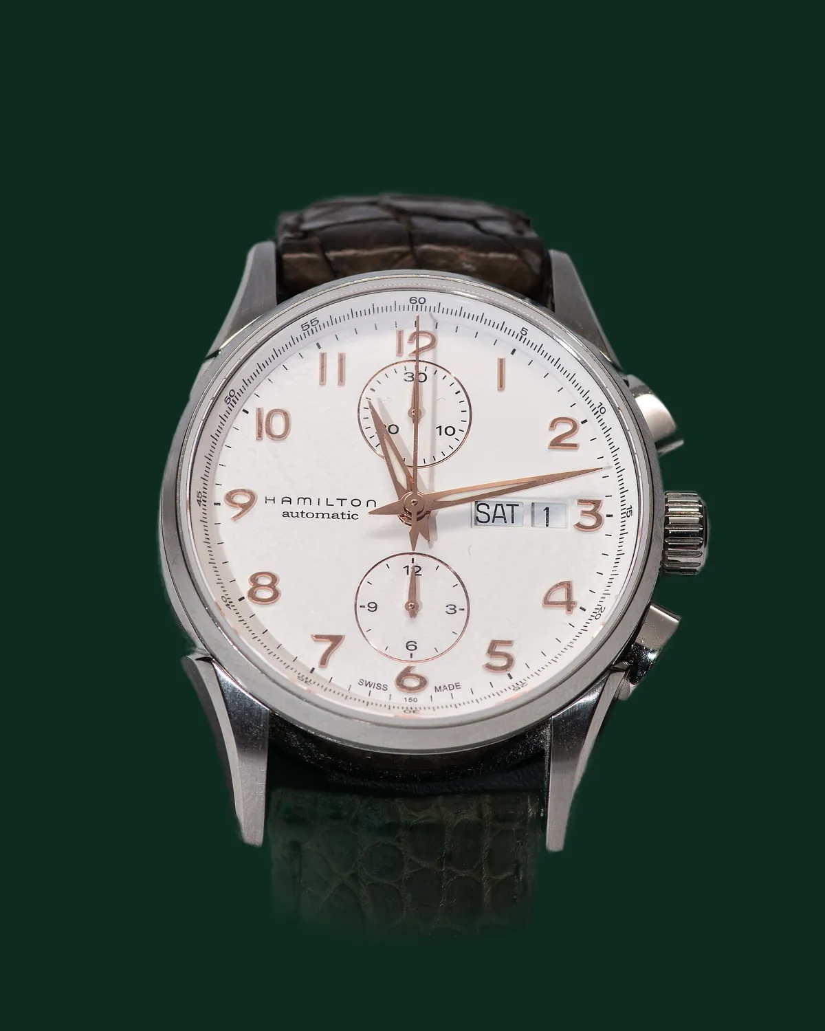 A dress watch with a white dial and a leather strap